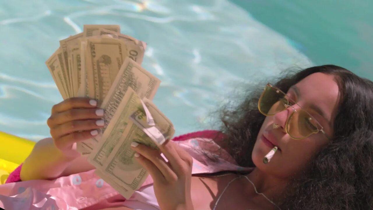 A trip of her life. Money Pool. Its a trip. Music clip 2013 Tattooed man in Pool with money.