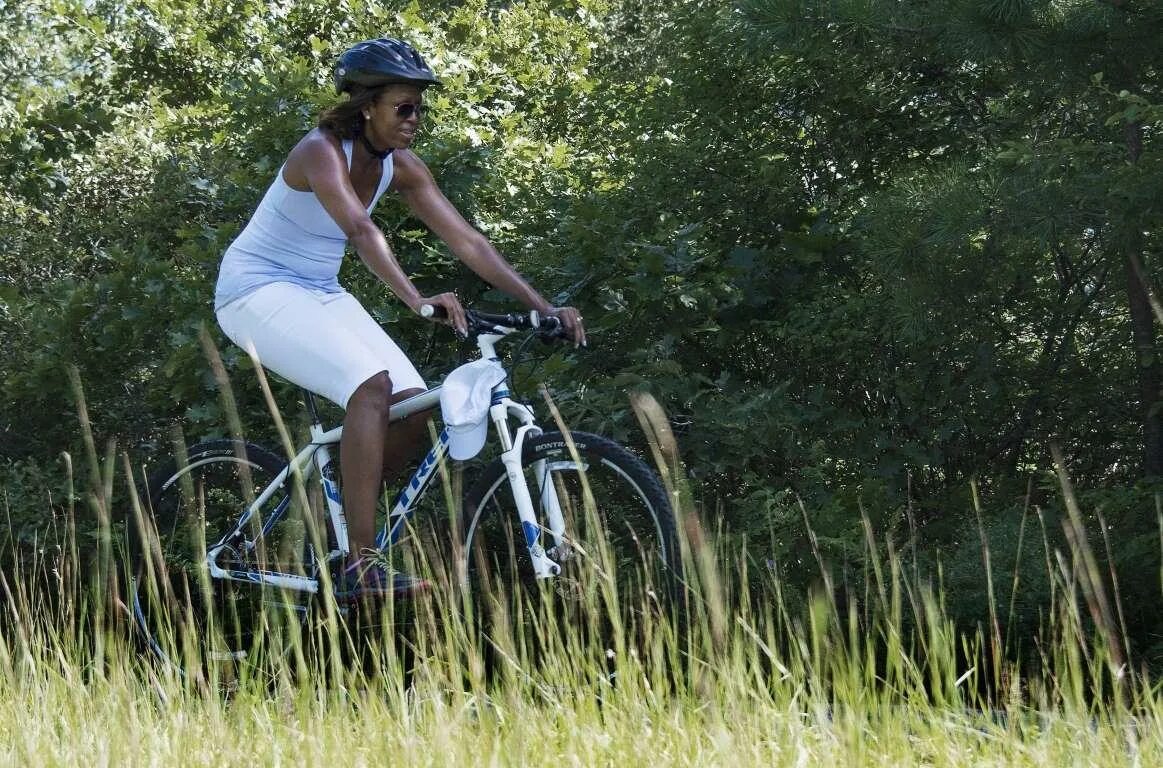 She her bike when she her. She is riding a Bike.