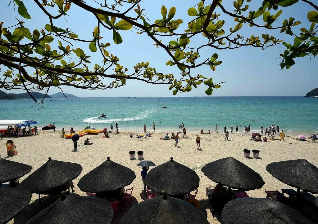 Китайский остров хайнань. Хайнань в марте. Хайнань в марте. Набережная дадунхай вечером фото. Хайнань в марте.