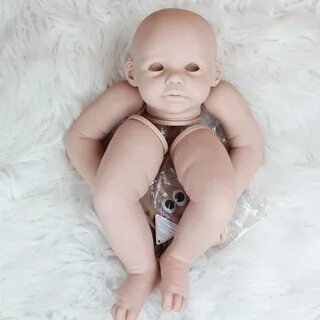 This item is blank doll kit, unassembled vinyl kit, the pictures of the fin...