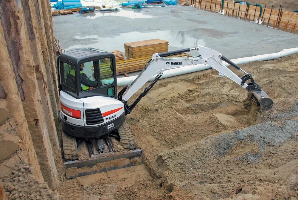 Bobcat e35. Миниэкскаватор бобкэт. миниэкскаватор bobcat е-50. bobcat е32. гидровлический бак на мини экскаватор бобкат е26.