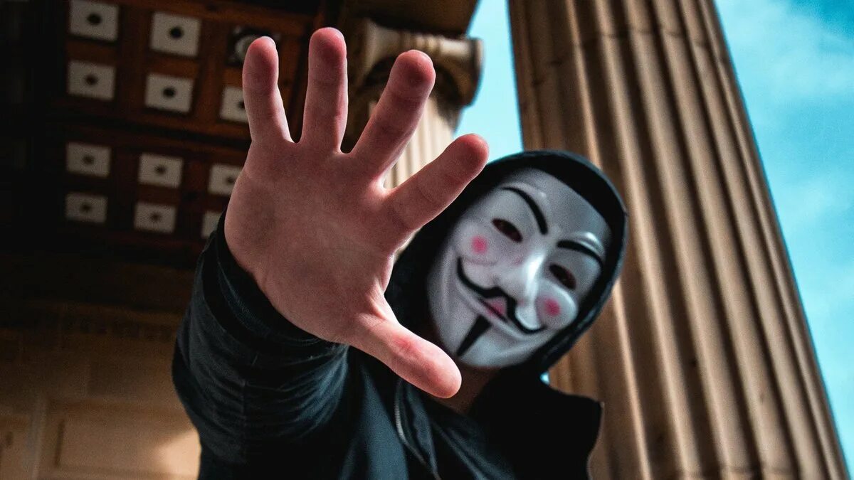 Как выглядят хакеры в реальной жизни Girl in the Hood Looking in the Camera. Hacker Attacks and Online Fraud on the S