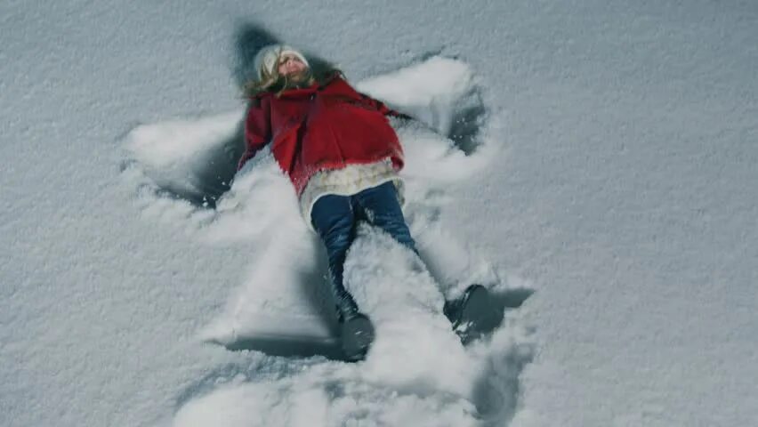 The snow fell. Снежный ангел на асфальте. lie on snow. fell into the snow. lie on snow art.