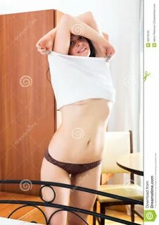 Girl Takes Off Underwear On Bed Stock Image - Image of bedroom, strip...