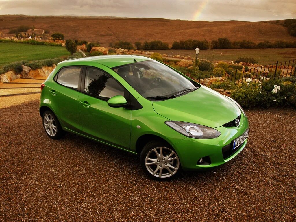Mazda 2. Mazda 2 2009. Mazda 2 зеленая. Мазда 2 2000.
