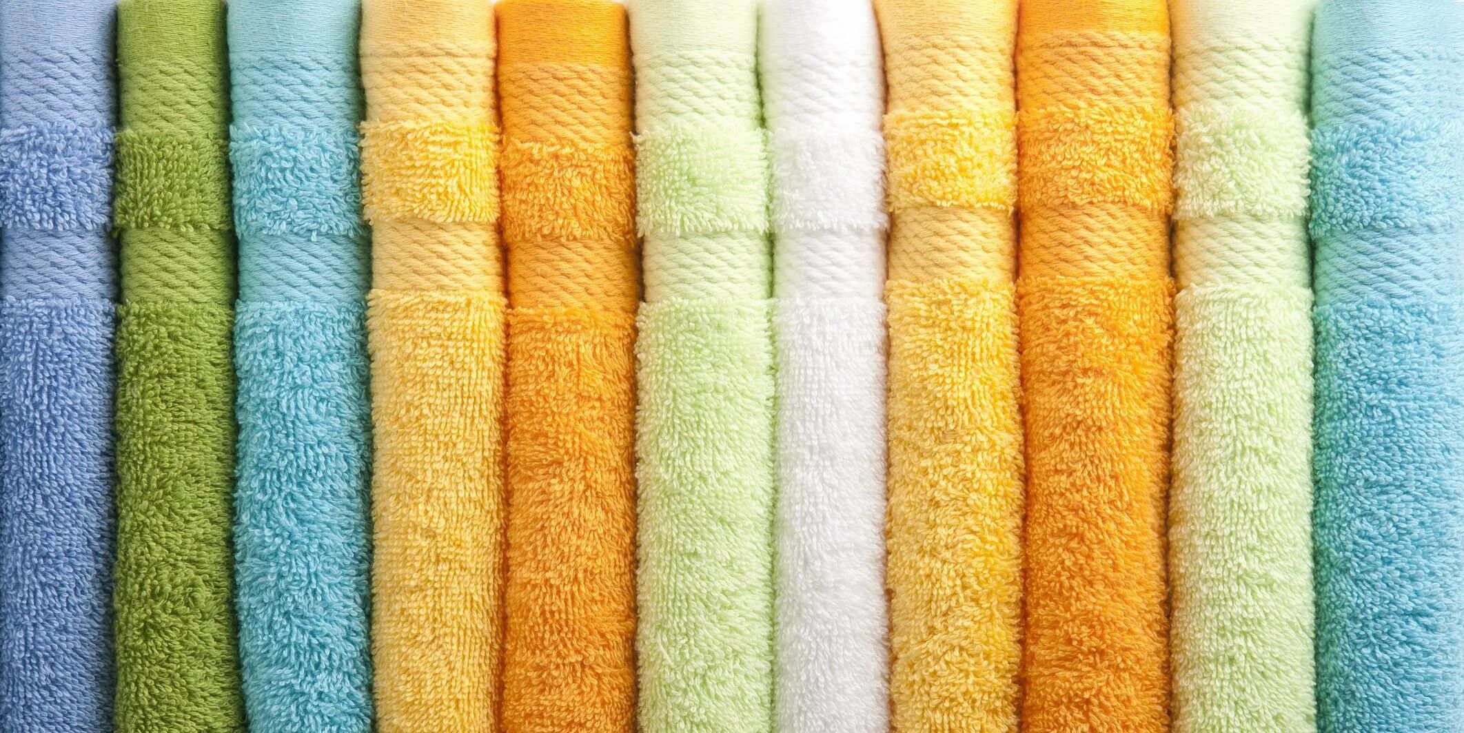 Аренда полотенец. Полотенце. Банное полотенце. Стопка махровых полотенец. Полотенце/разноцветное.