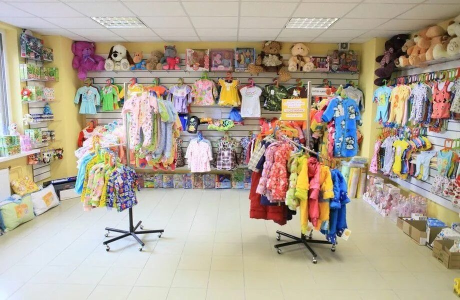 Детский магазин г. Детский магазин. Детские одежды. Магазин одежды для детей. Детский отдел одежды.