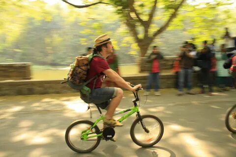 He s riding a bike