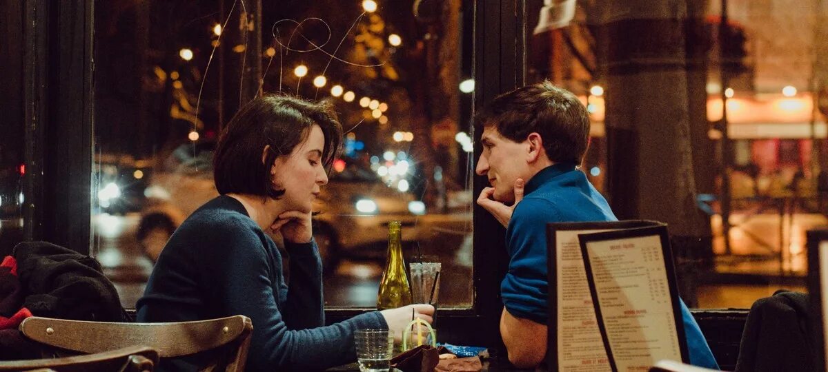 Sit between them. Sit between them