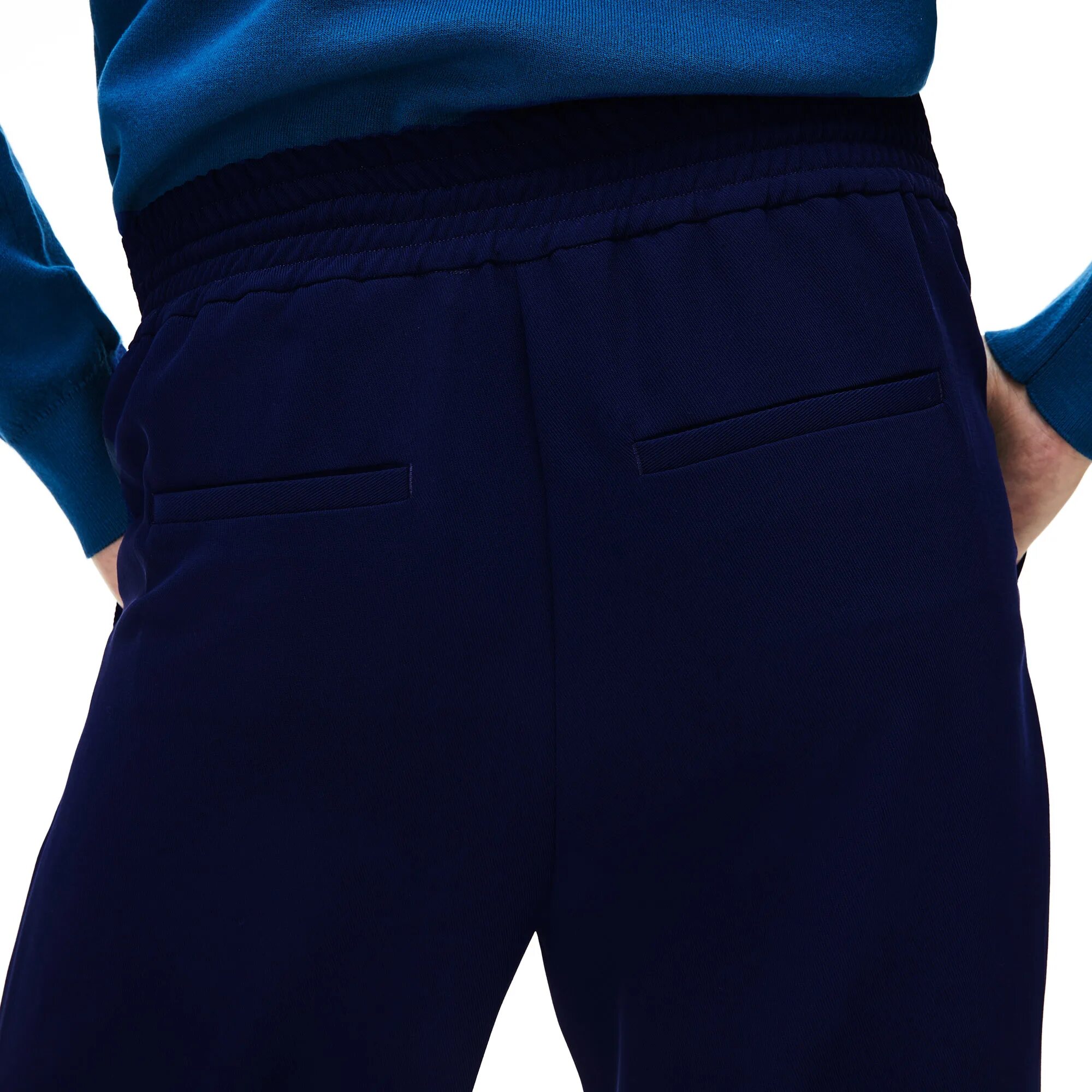 Темно синий брюки купить. Брюки лакост синие. Брюки лакосте uk 38 размер. Темно синие штаны Lacoste женские. Голубой штаны лакоста.