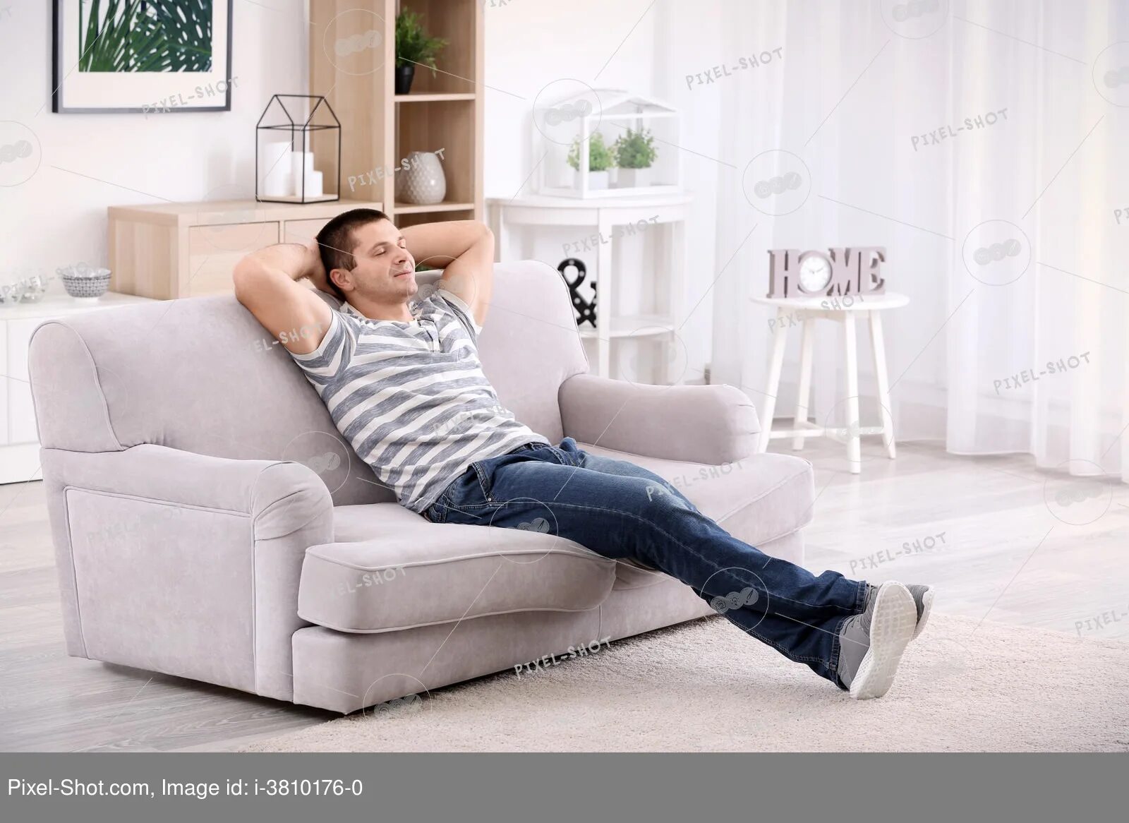 He is on the sofa