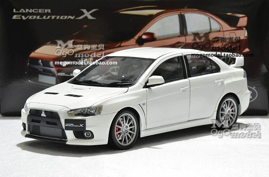 Крыло mitsubishi lancer. Mitsubishi Lancer Evolution x 10 1:18. Lancer EVO 1/18 CSM. Митсубиси Лансер 10 модель игрушка. Модель машины Мицубиси Лансер 10.