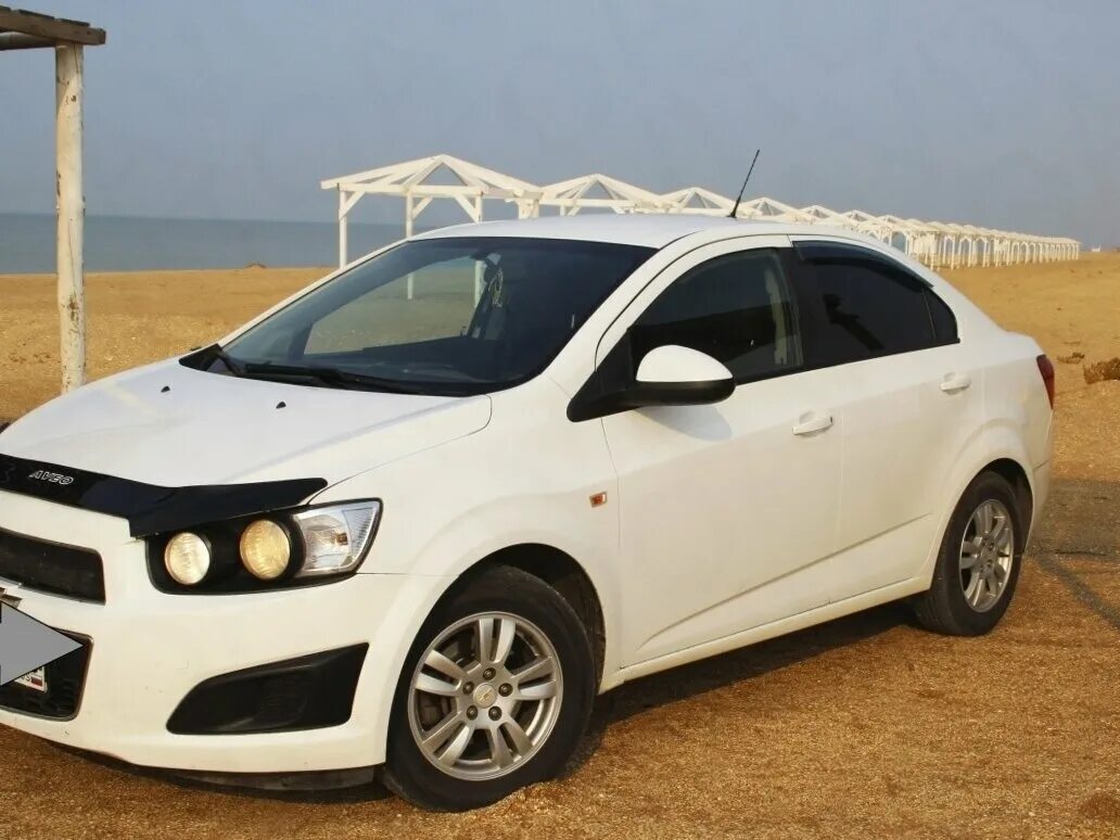 Купил авео 2012. Chevrolet Aveo 2012. Chevrolet Aveo 2012 белый. Шевроле Авео седан 2012 белая. Chevrolet Aveo 2012 седан белый.