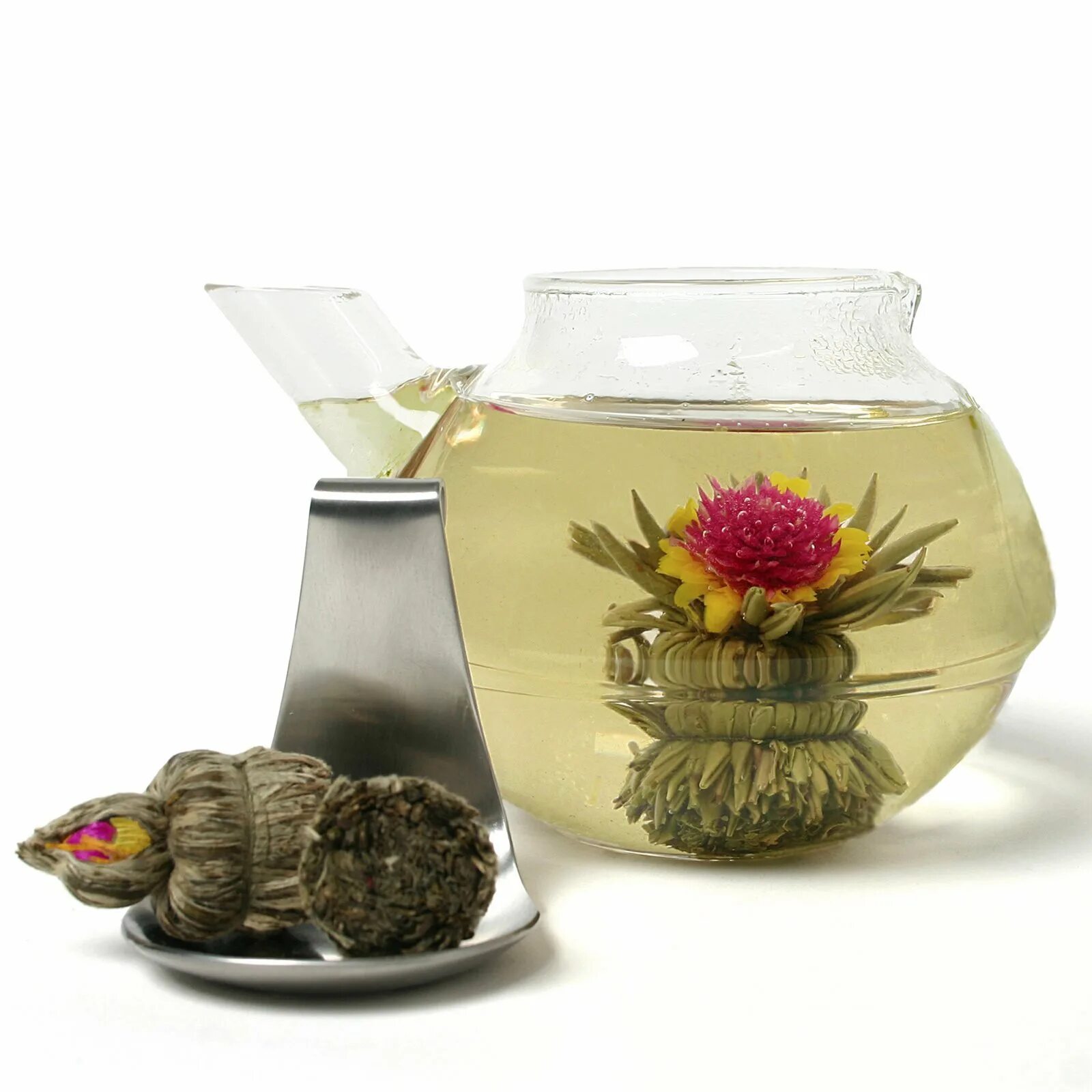 Китайский чай в шариках. Китайский чай цветок распускается. Зеленый чай цветок распускается.