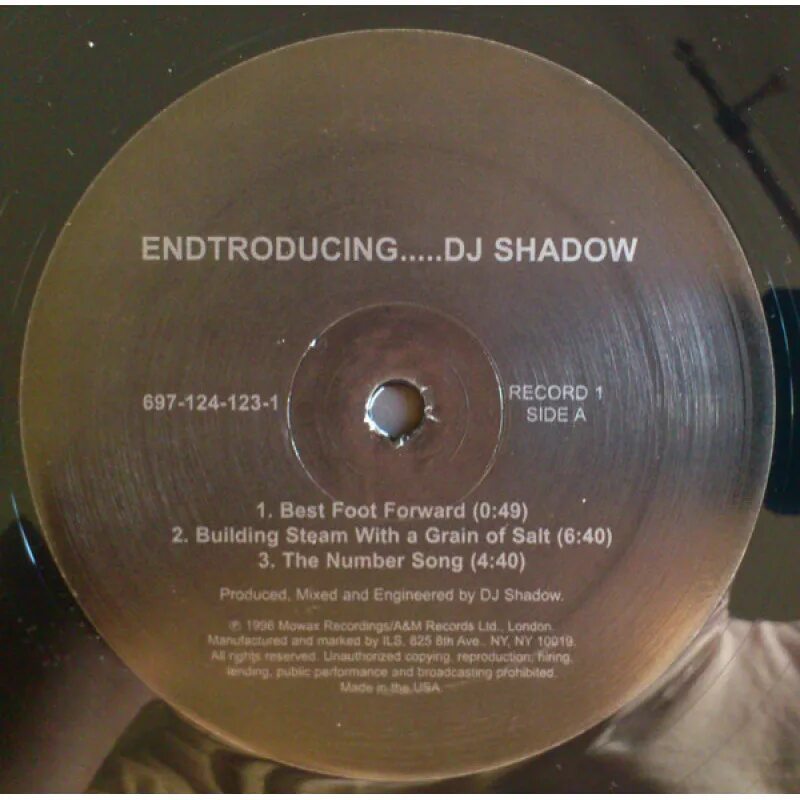 DJ Shadow "Endtroducing". DJ Shadow Endtroducing обложка. DJ Shadow в горе винила. DJ Shadow Endtroducing MC Ride.