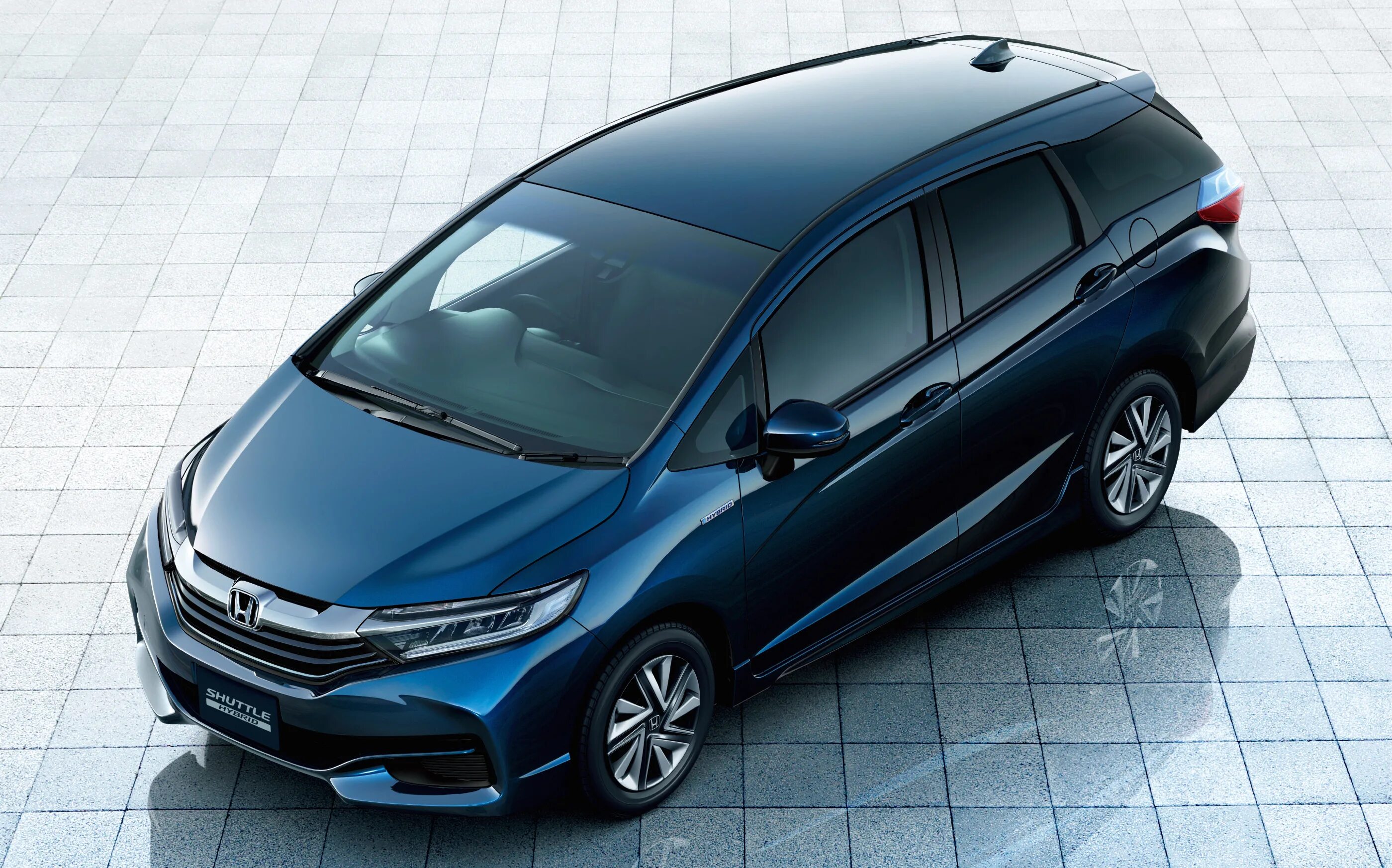 Хонда фит шаттл гибрид 2015. Honda Fit Shuttle. Honda Fit Shuttle Hybrid 2016. Хонда шаттл 2015 гибрид.