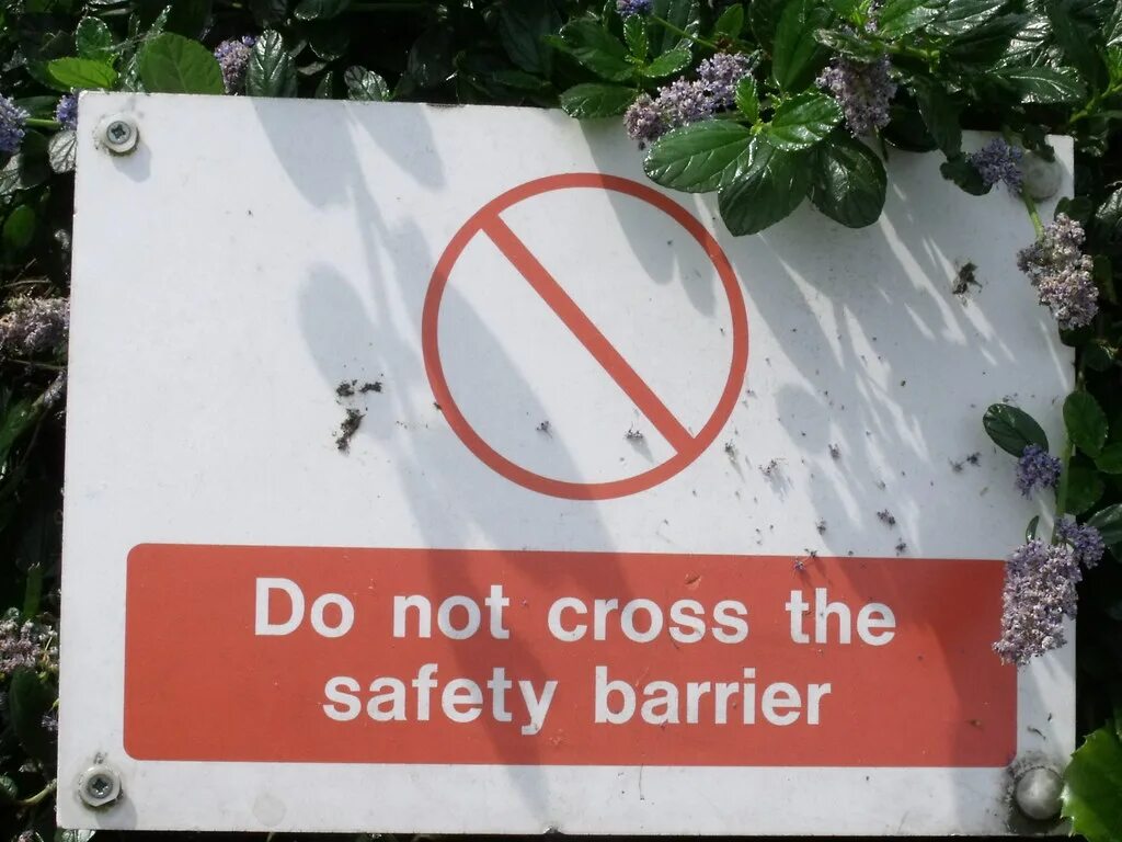 Warning signs don't Cross the Barrier. Country not allowed. Barrier sign. Sign in the Barrier Boom for Level indication.