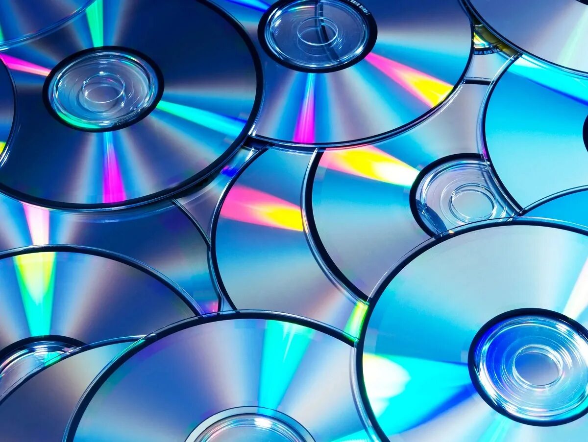 Изображение дисков на компьютер. Куча дисков. красивый cd диск. компакт-диски фон. cd диски фон.