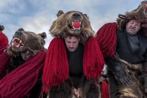 A troupe of bears from Asău village performs in central Comăneşti during th...