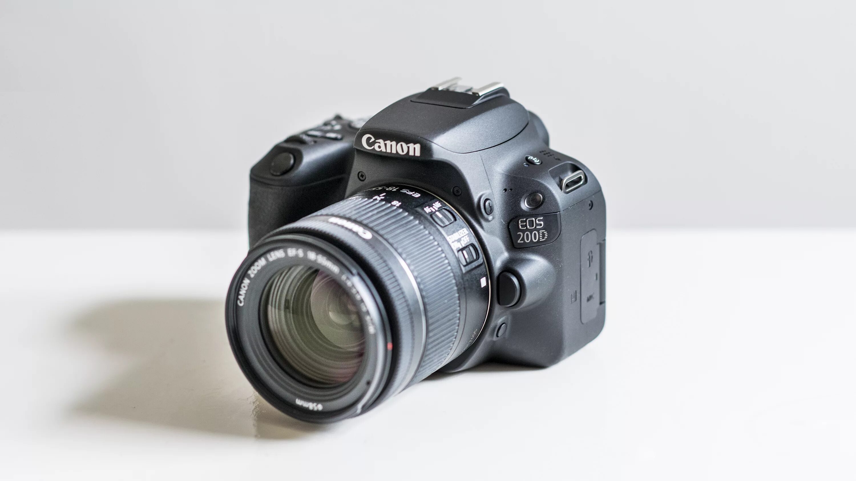 Canon ru фотоаппарат. Фотоаппарат Canon EOS 200d Kit. Canon Rebel sl2. Canon 200 Kit. Canon 200d разъемы.