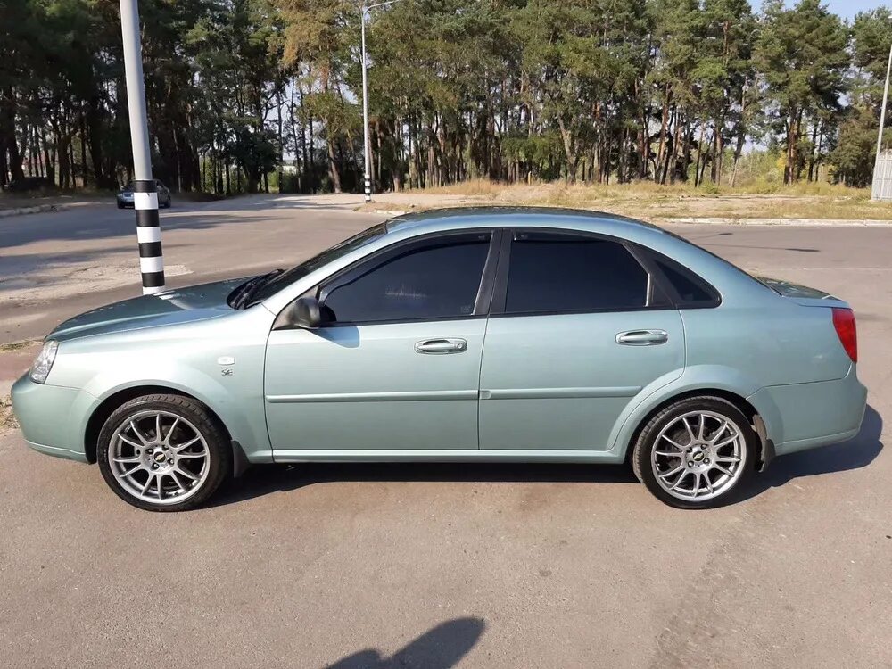 Лачетти хэтчбек колеса. Chevrolet Lacetti r17 колеса. Lacetti колеса r16. Lacetti Chevrolet хэтчбек r16. Шевроле Лачетти на дисках r17.