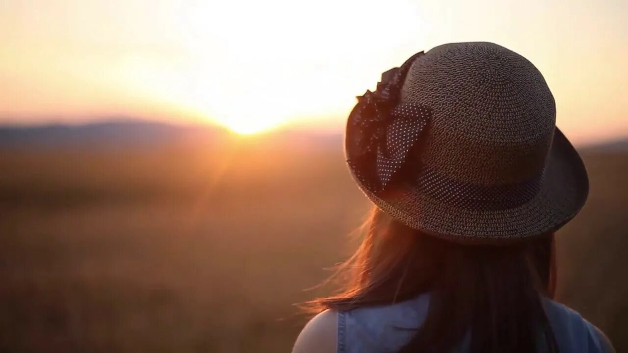 Looking at Sun. Looking ahead. Girl looking at Sun. Girl looks far ahead. Further ahead