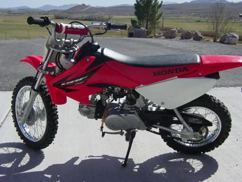 Honda crf70f. CRF 70. ЦРФ 70. Crf70 характеристики. Honda 70