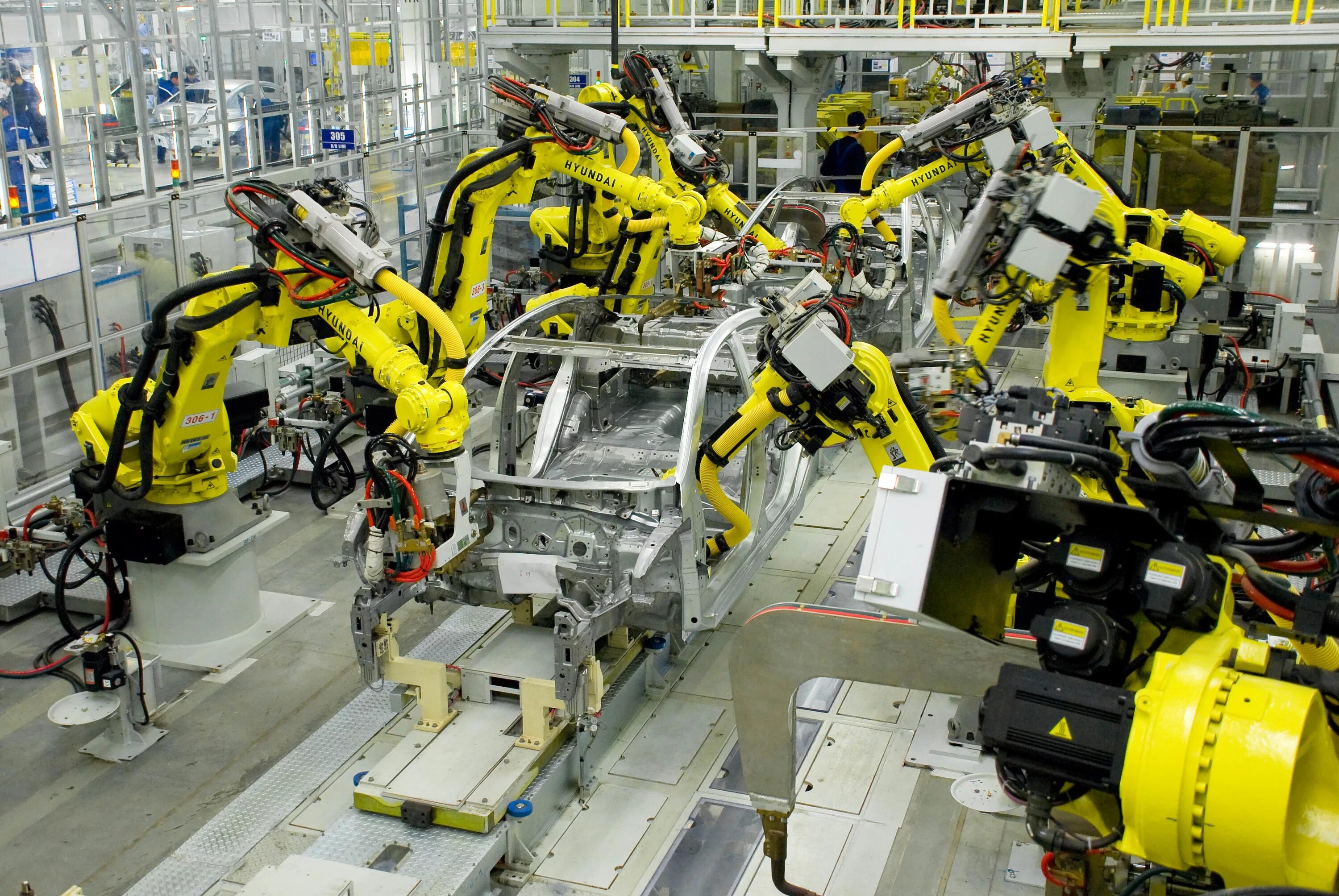 Хендай завод цех. Промышленные роботы. Сборочные промышленные роботы. Робот для сборки автомобилей.