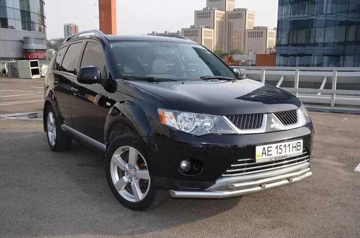 Купить мицубиси 2007. Mitsubishi Outlander XL 2007. Mitsubishi Outlander 2007xl максимальный пробег. Стакан Митсубиси Аутлендер 2007. Митцубиши Аутлендер XL дуги на перед.