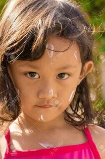 Closeup Face of Asian Little Girl with Sunblock Lotion Before Swimming - 44...