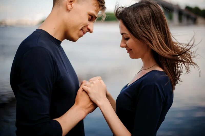 Looking at each other. Couple looking each other. Look at each other. Two people looking at each other PNG. Couple standing against each other.