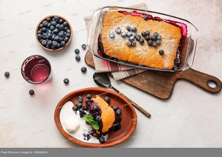 Composition with blueberry cobbler and ice cream on light background. 