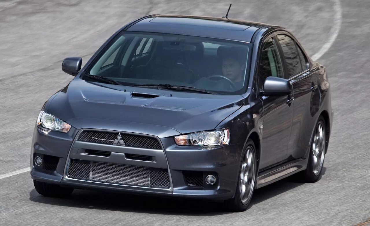 Mitsubishi lancer 2012. Митсубиси Лансер Эволюшн 2010. Митсубиси Лансер 2012. Mitsubishi Lancer EVO 2010.