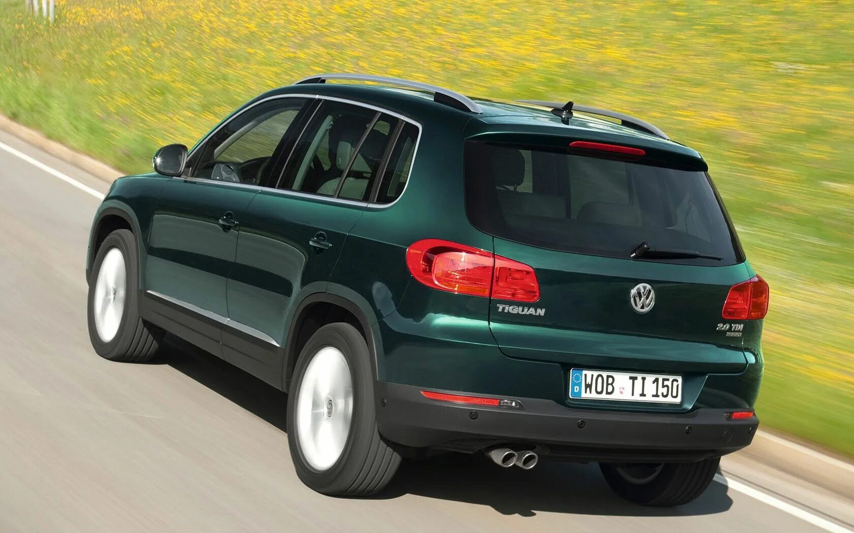 Volkswagen tiguan tdi. Фольксваген Тигуан 1. Volkswagen Тигуан 2012. VW Tiguan 2011. Фольксваген Тигуан 4.