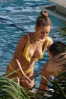 Annemarie Carpendale in Yellow Bikini on the pool in Miami. 