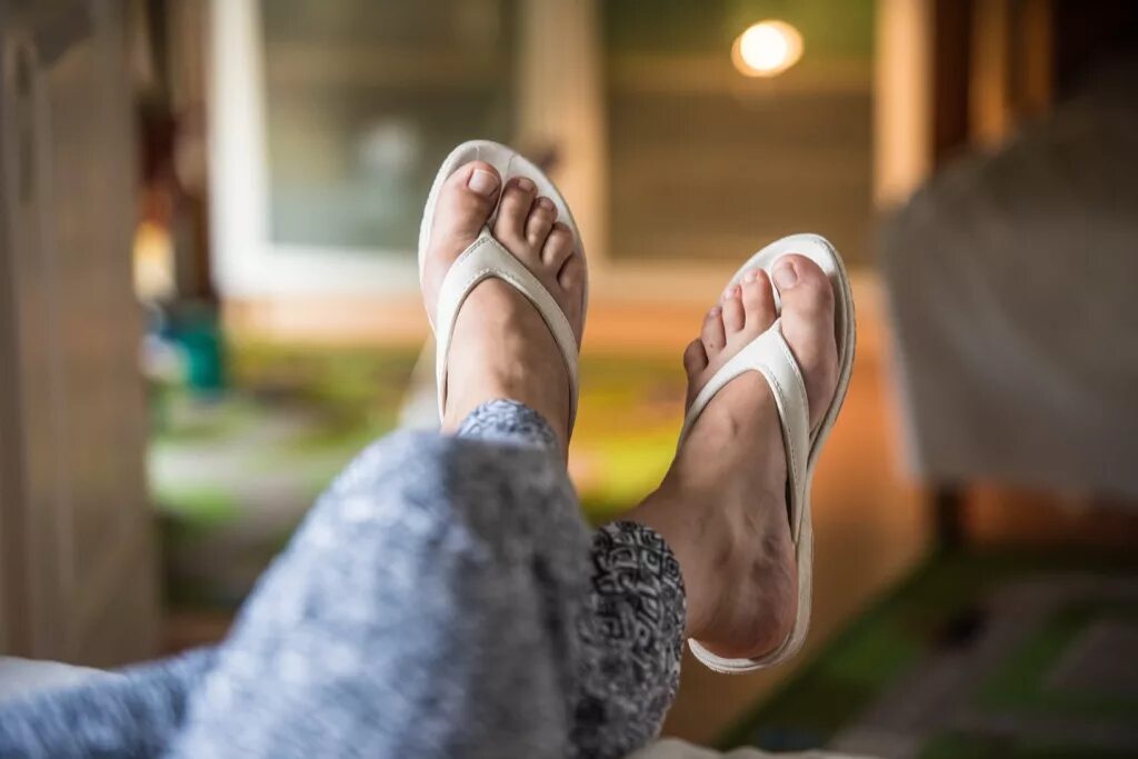 Woman wearing Slippers. Shutterstock Flip Flops. Dress for your feet реклама. Wearing Slippers at Home. Feet relax