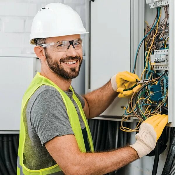 Young electrician technician works in compliance with safety standards in a resi