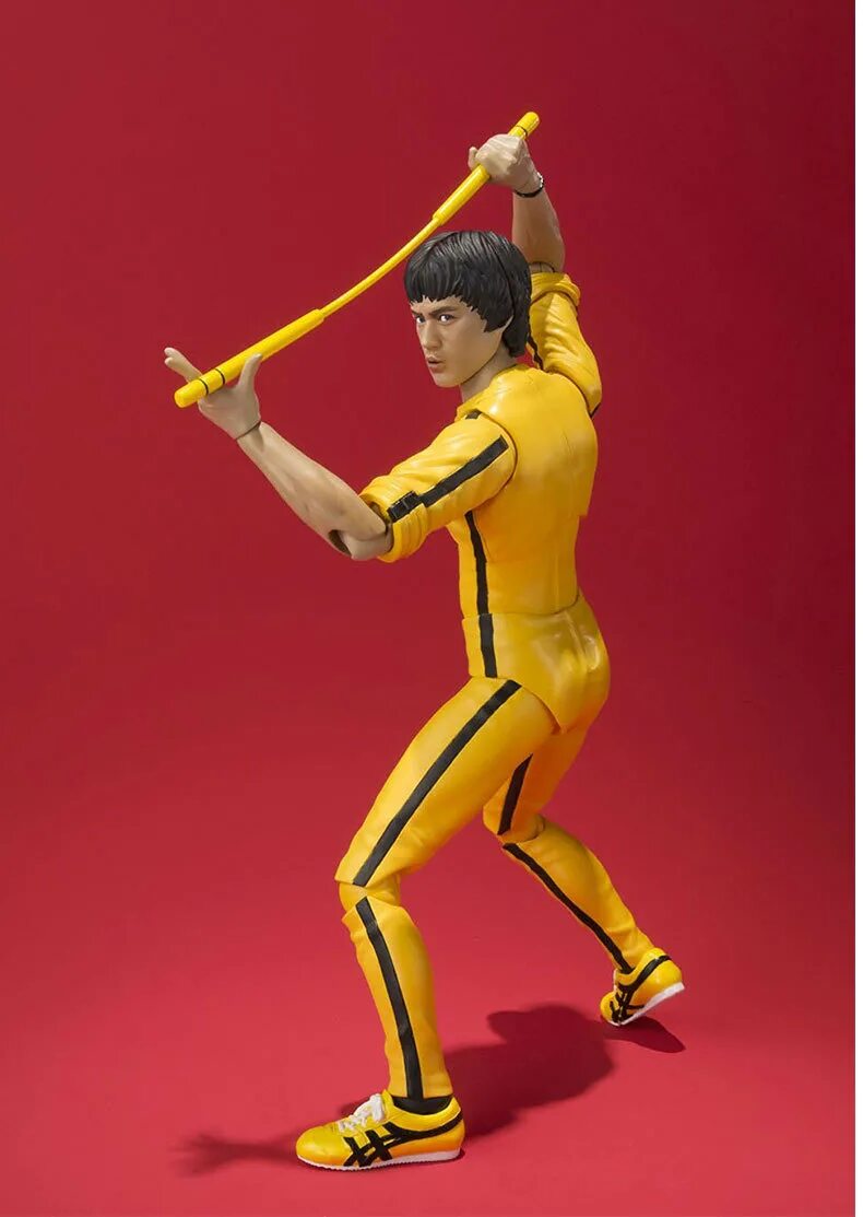 Брюс ли купить. Bruce Lee в желтом костюме. Желтый костюм Брюса ши. Костюм Брюса ли. Брюс ли в желтом спортивном костюме.
