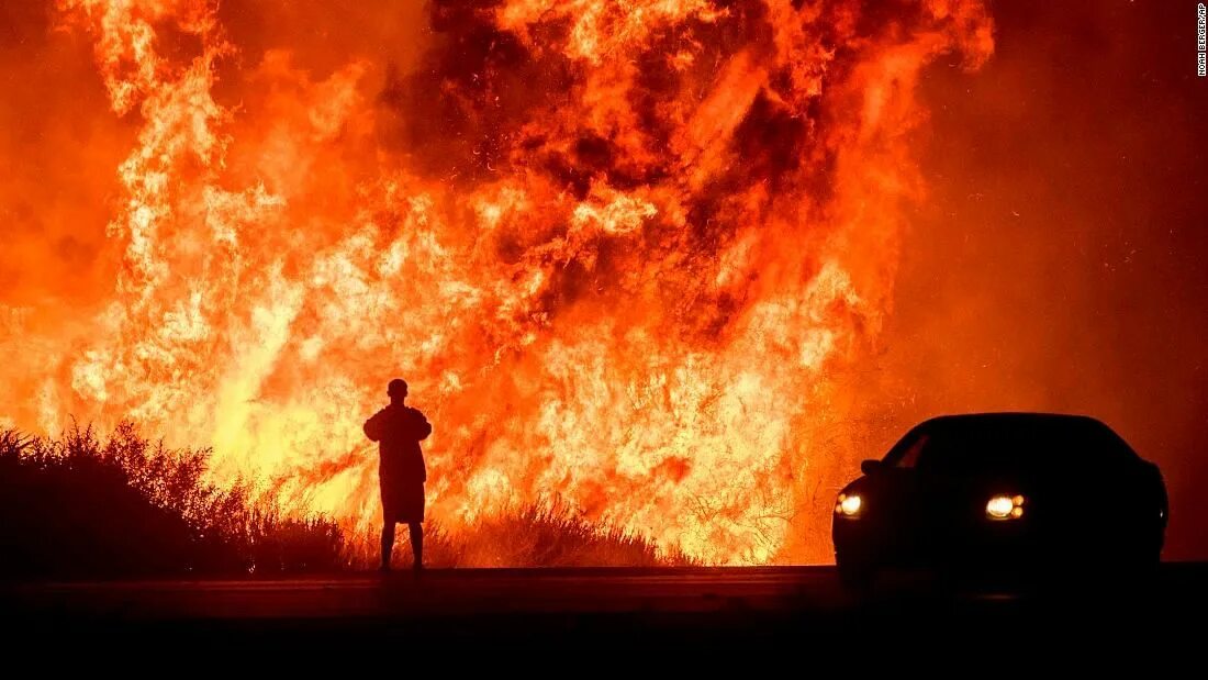 Man in the fire. Man in fire. to catch fire disaster. a man with a burning back. transit - catch fire.