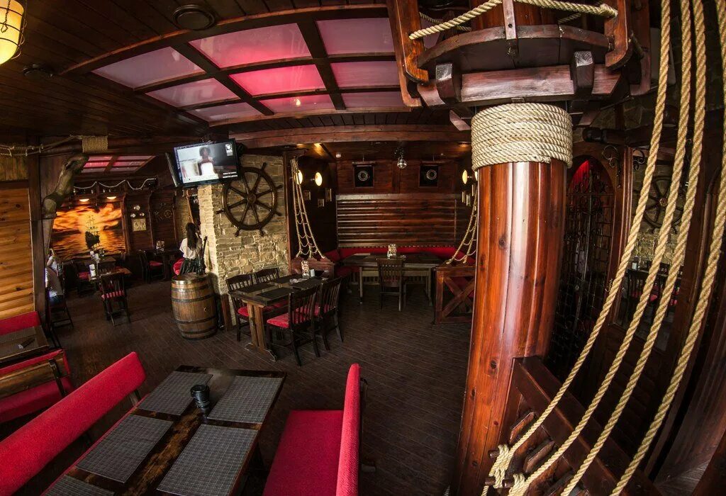 Кафе в пиратском стиле. Пиратский бар. Пиратский бар. Бар на тортуга пираты карибского. Паб в пиратском стиле.