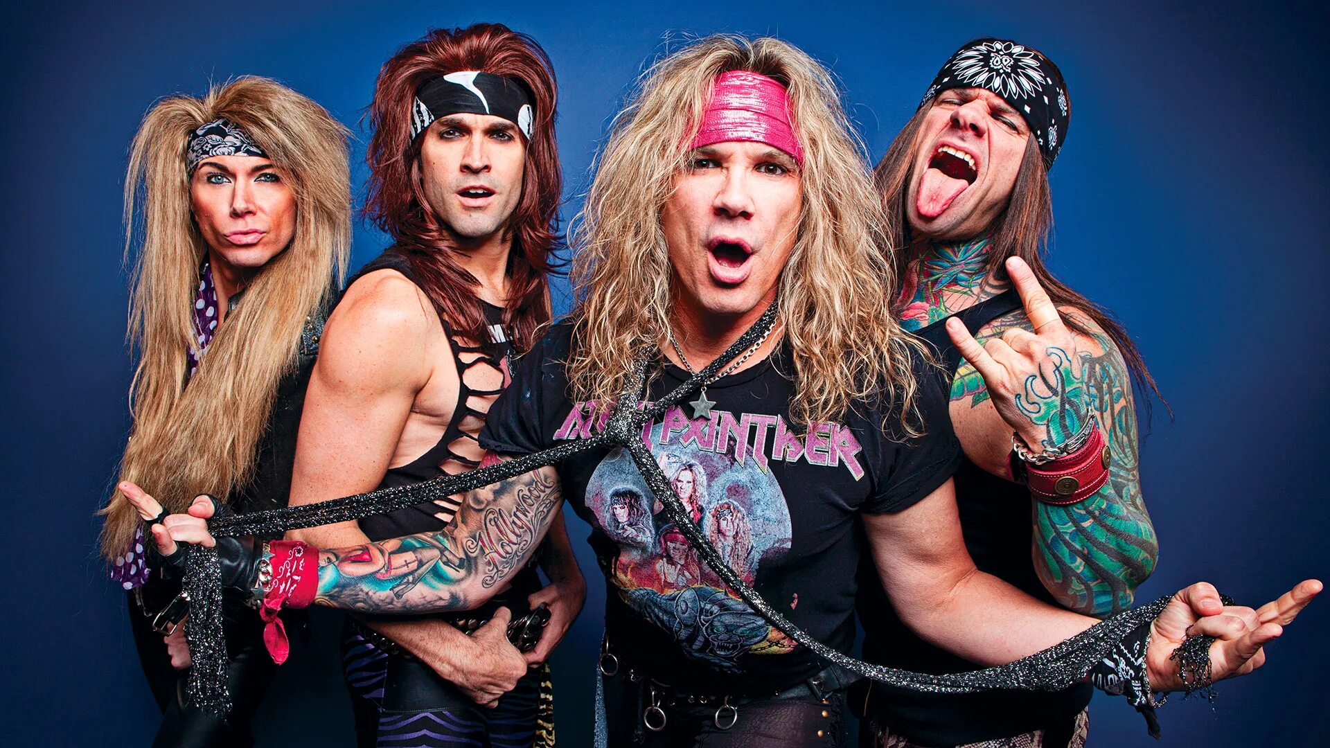 Steel Panther гитарист. Басист Steel Panther. Steel Panther вокалист. Группа Steel Panther 2000.