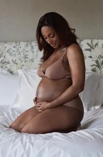 Alexandra Burke strips to her underwear to show off growing baby bump as sh...