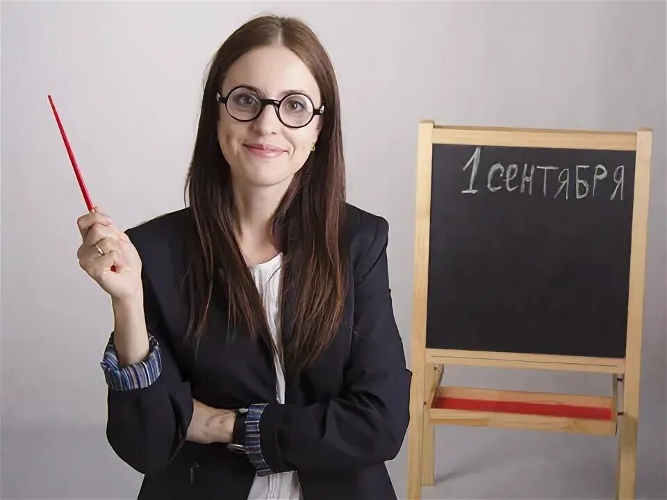 Attentive Teacher in Eyeglasses Pointing at Stock Image - Image of blackboard, p