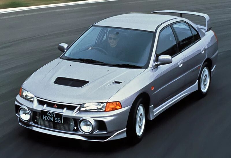 Мицубиси самая самая. Митсубиси Лансер Эволюшн 5. Mitsubishi Lancer Evolution 1. Mitsubishi Lancer Evolution 4 GSR. Митсубиси Лансер Эволюшн 1992.