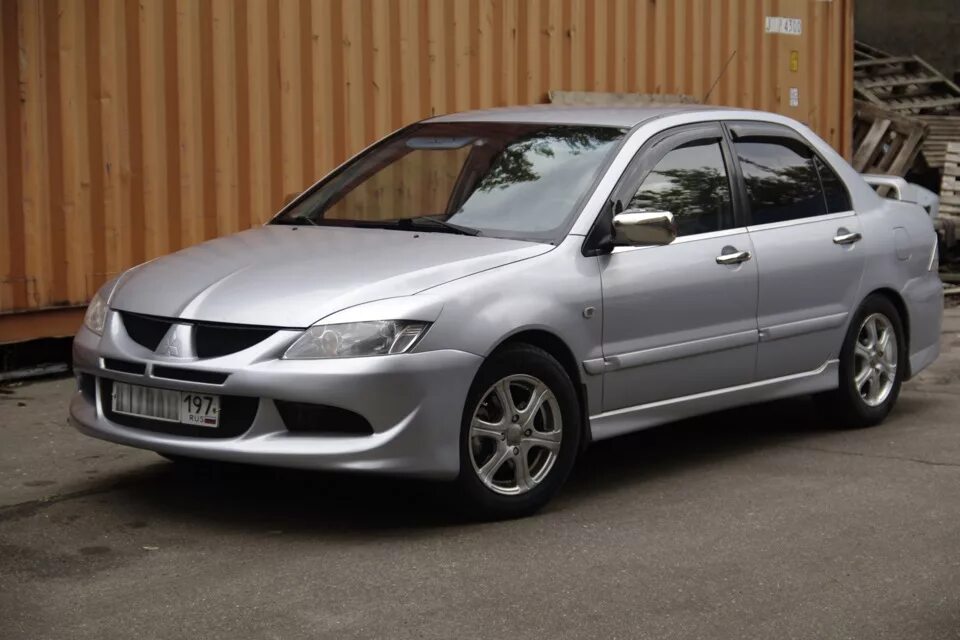 Бампер mitsubishi lancer 9. Mitsubishi Lancer 9 бампер EVO. Mitsubishi Lancer 9 2009. Митсубиси Лансер 9 1.6. Бампер в стиле Эво Лансер 9.