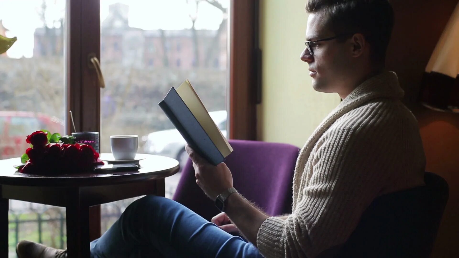 Finish reading. A person reads a book in cafe. reading book and coffee.