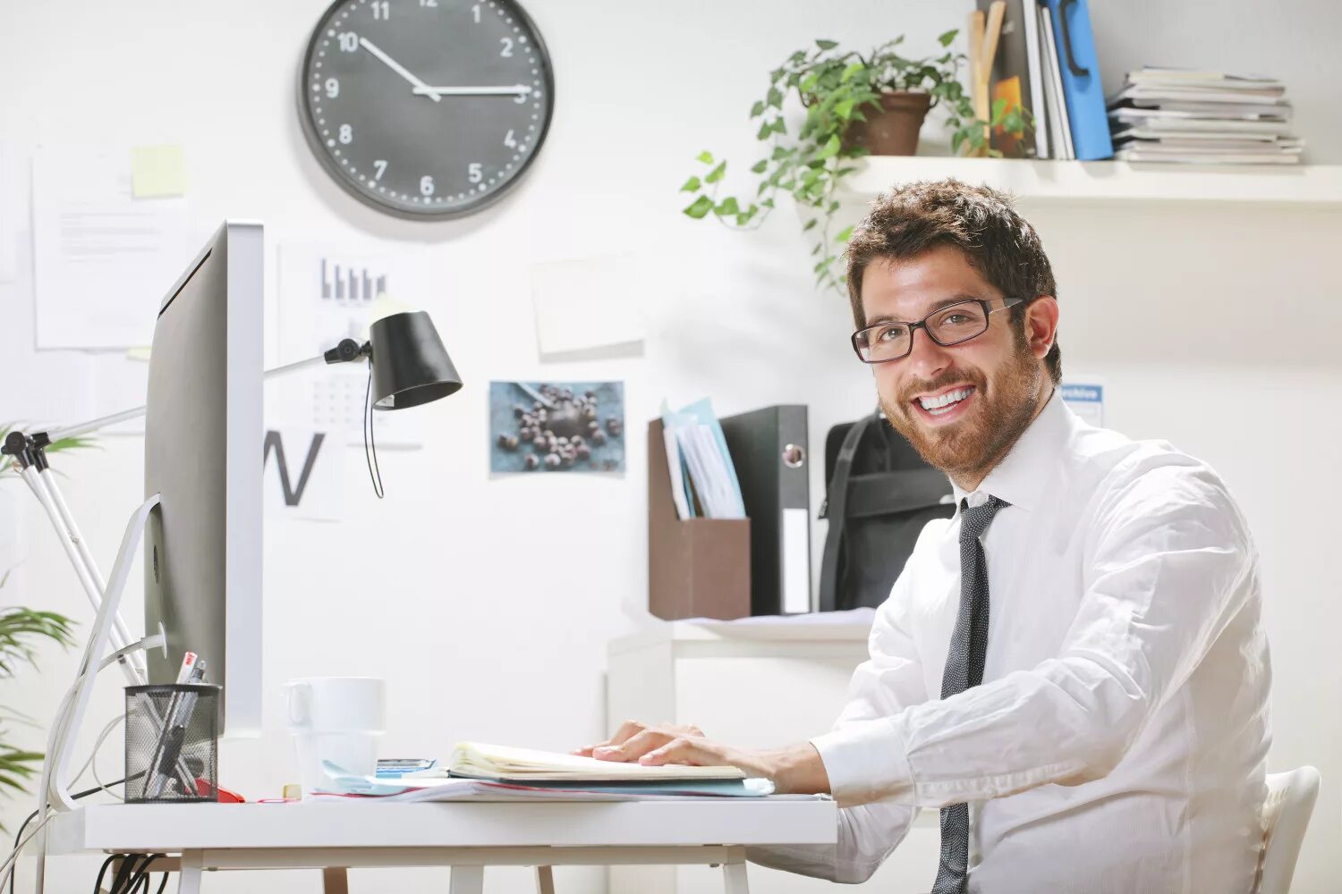He is working in the office