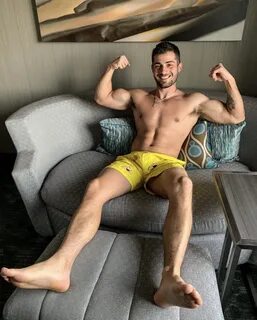 Bruno Baba showing off his biceps and male soles.
