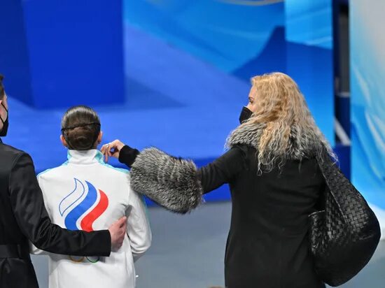 Tearful Kamila Valieva summons up remarkable skate to lead short program after d