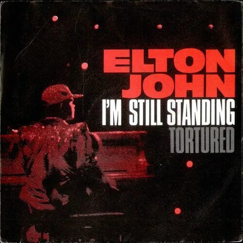 Песня im still. Элтон Джон im still standing. Элтон Джон Стэндинг. Elton John im still standing обложка. Elton John i'm still standing альбом.